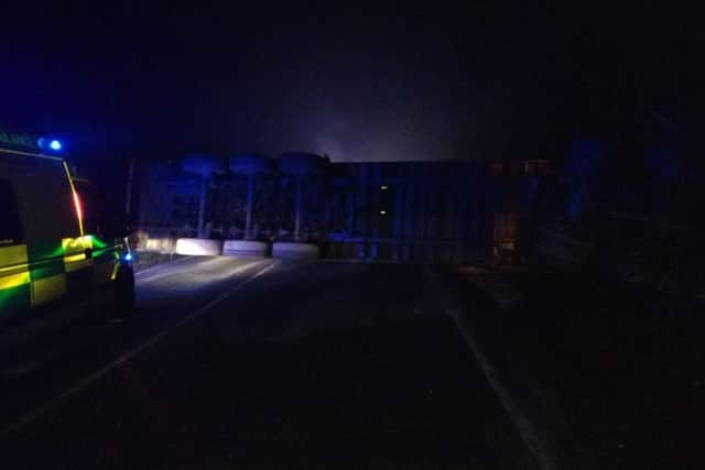 An overturned lorry has shut the A15 in both directions this morning