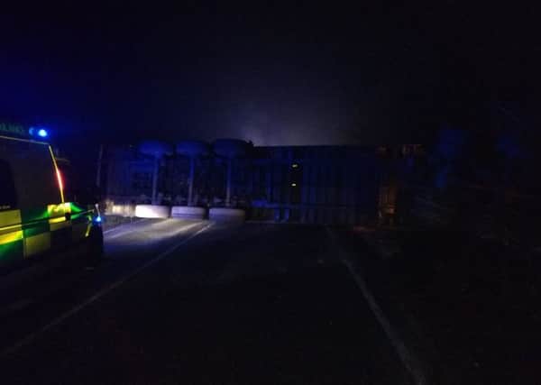 An overturned lorry has shut the A15 in both directions this morning