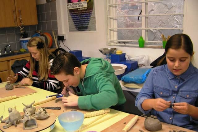 Children taking part in sessions at Alford Craft Market. EMN-170117-160548001
