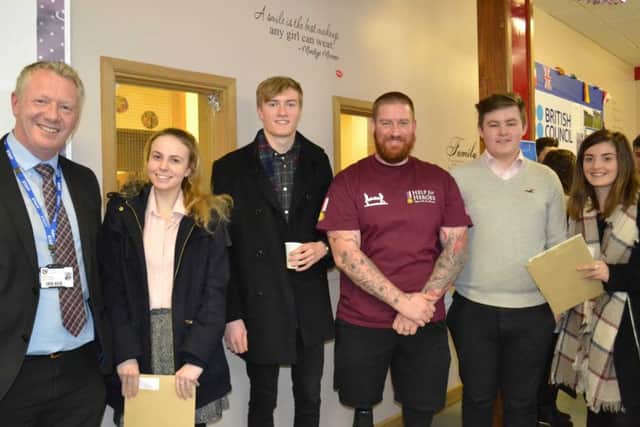 Former Year 13 students Katharine Bradford, Tom Lane, Nathanial McNarry and Becca Dwane, joined by Nathan Cumberland (centre) and Mr Brogan (left) deputy headteacher. EMN-170120-093538001