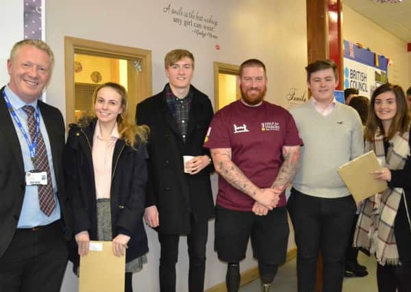 Former Year 13 students Katharine Bradford, Tom Lane, Nathanial McNarry and Becca Dwane, joined by Nathan Cumberland (centre) and Mr Brogan (left) deputy headteacher. EMN-170120-093538001