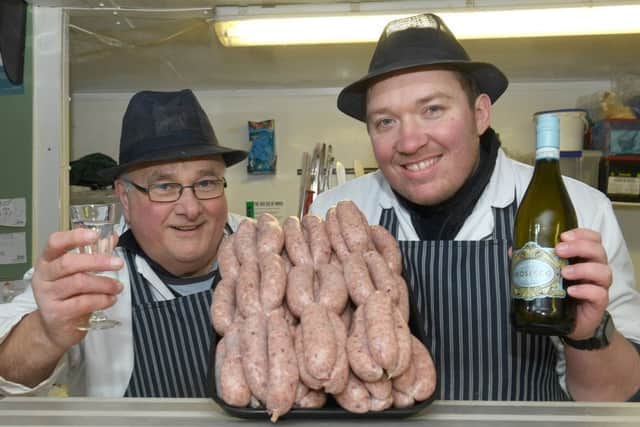 John White and Steve Archer of Manor Farm Butchers with some Prosecco sausages. EMN-170123-102916001