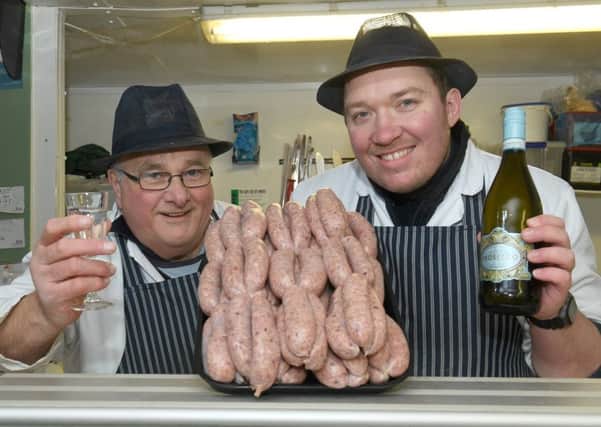 John White and Steve Archer of Manor Farm Butchers with some Prosecco sausages. EMN-170123-102916001