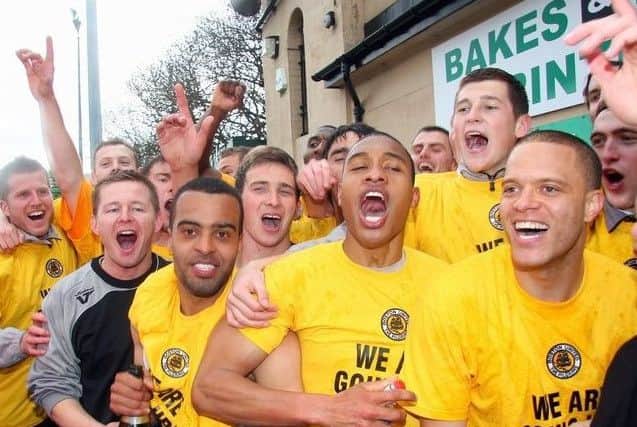 United celebrate promotion at Bradford Park Avenue.