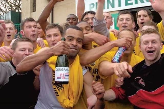 United celebrate promotion at Bradford Park Avenue.
