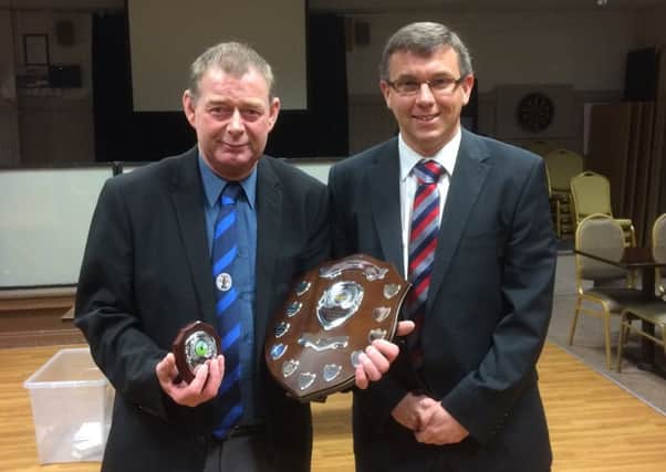 Terry Knott (left) receives the Richard Taylor Award from Lincolnshire County Referees Association chairman Gary Sutton.
