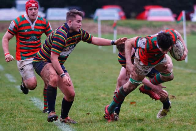 George Grant is stopped in his tracks by determined defence from Old Scouts EMN-170123-122054002