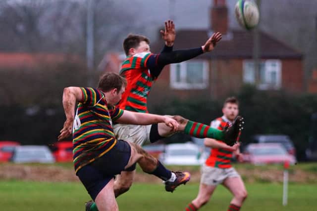 Dan Robinson, who had another impressive afternono with the boot, tries to make a block EMN-170123-122118002