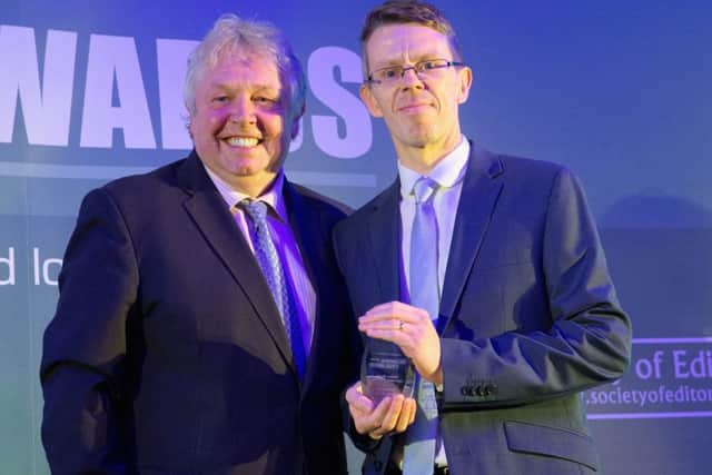 Melton Times sports editor Chris Harby receives the Weekly Sports Journalist of the Year award from radio broadcaster Nick Ferrari at the UK Regional Press Awards EMN-170119-165303002