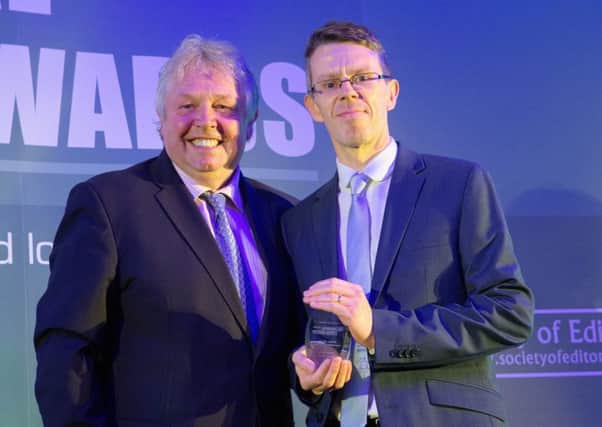 Melton Times sports editor Chris Harby receives the Weekly Sports Journalist of the Year award from radio broadcaster Nick Ferrari at the UK Regional Press Awards EMN-170119-165303002