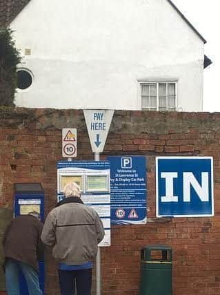 All pay: People line up to pay at the St Lawrence Street car park where town councillors would liked to see charges scrapped for major events.