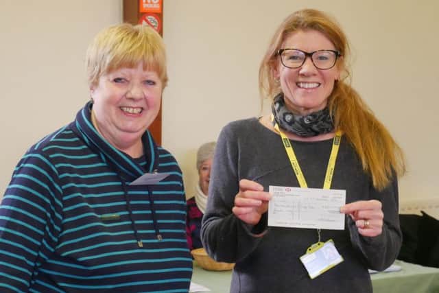 Spa Afternoon WI president Hazel White presented LIVES representative Heide Wickes with a cheque for ?163 raised from our Christmas raffle. EMN-170126-100621001