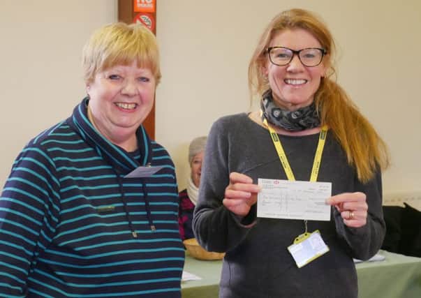 Spa Afternoon WI president Hazel White presented LIVES representative Heide Wickes with a cheque for ?163 raised from our Christmas raffle. EMN-170126-100621001