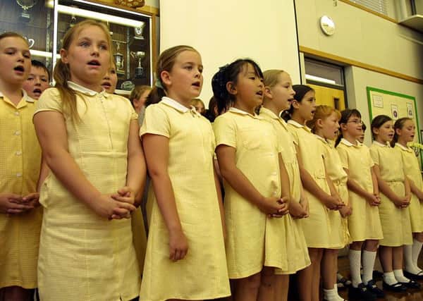 Pupils performing at the opening of an extension at Richmond School in June 2004.