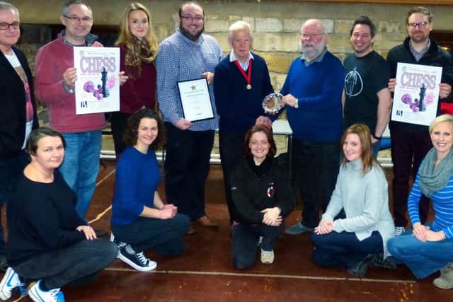 Members of BOS Musical Theatre Group pictured with NODA regional councillor Peter Breach presenting the award to chairman Stuart Bull. EMN-170126-130737001