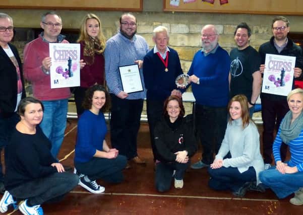 Members of BOS Musical Theatre Group pictured with NODA regional councillor Peter Breach presenting the award to chairman Stuart Bull. EMN-170126-130737001