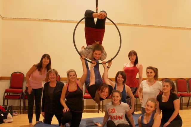 Aerial dance fitness classes are taking place in Boston. EMN-170123-153719001