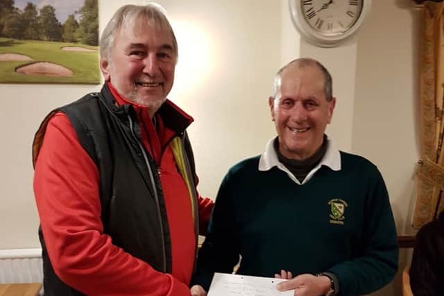 Chris Brooke receives his prize from seniors club secretary Nick Robey EMN-170123-162224002