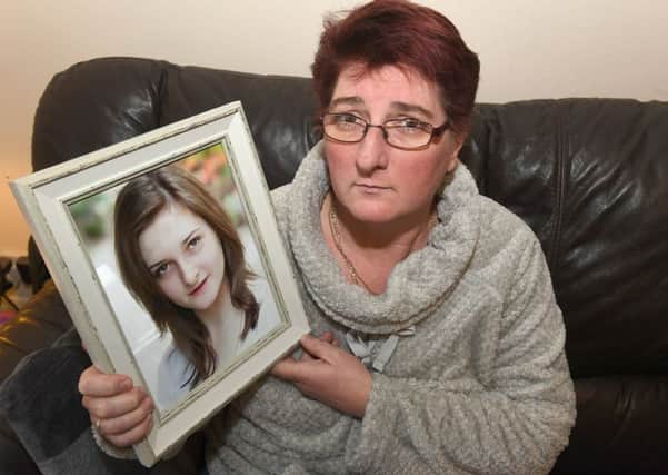 Jess Danby's mother Dawn Ducker with a picture of her daughter.