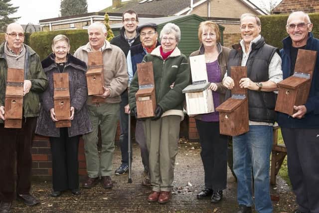 The Orchards park residents with Tim Wells (centre, rear) and the bird boxes which will soon be home to spring chicks. EMN-170124-122926001
