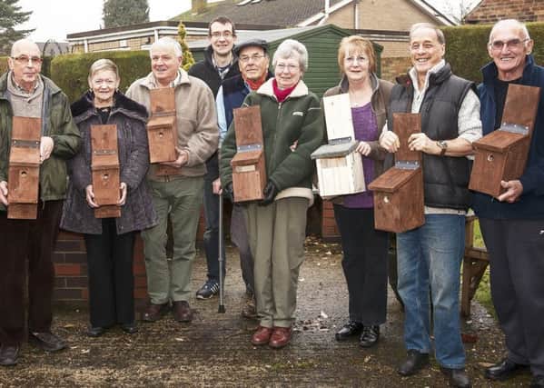 The Orchards park residents with Tim Wells (centre, rear) and the bird boxes which will soon be home to spring chicks. EMN-170124-122926001