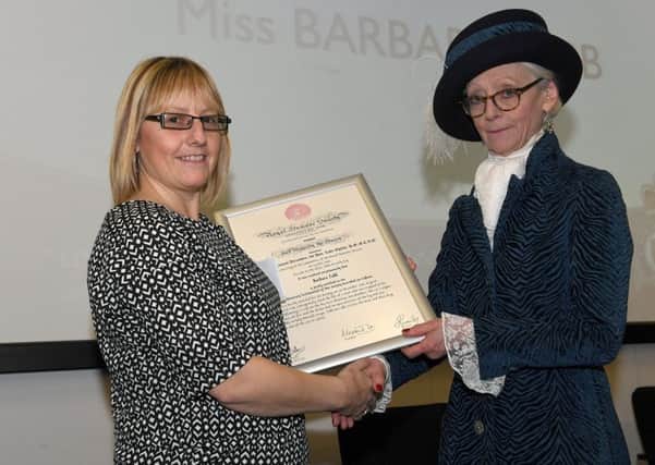 Chief Constable's Award Ceremony at Lincoln HQ. Barbara Tebb receiving Royal Humane Society Testimonial on Vellum award. EMN-170127-102733001