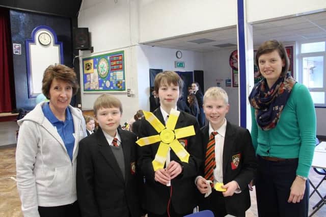 Daniel Allen, Ben Payne and Lewys Whitfield with their homemade turbine, alongside Michelle James and Laura Peach.