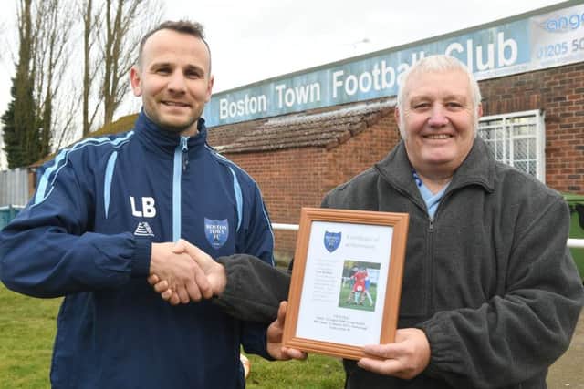 Lori Borbely presented with an award by Dave Creasey for 400 games for Boston Town.