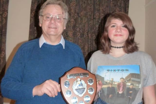 Hollie Vines was named Young CATS Person of the Year and received her award from chairman Mike Cluff (photo by Linda oxley). EMN-170202-142629001