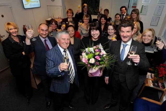 Marking 25 years ... Patrick Cordingley, Tracey Dawson, Edward Conway and the Boston team.