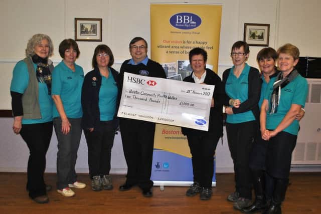 Richard Tory, chairman of Boston Big Local, presenting a cheque for £1000 to the group leaders, from left, Helen Welbourn Cook, Rosemary Saunders, Margaret Kenny, Richard Tory, Fran Taylor, Karen Bridges, Barbara Jackson and Lyn Pearson.