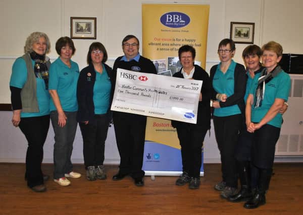 Richard Tory, chairman of Boston Big Local, presenting a cheque for Â£1000 to the group leaders, from left, Helen Welbourn Cook, Rosemary Saunders, Margaret Kenny, Richard Tory, Fran Taylor, Karen Bridges, Barbara Jackson and Lyn Pearson.