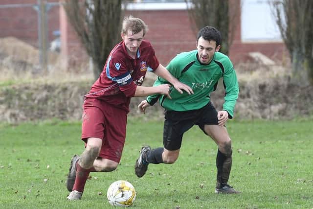 Kristian Taylor battles with Will Allen in FC Hammers' 4-1 defeat to Fulbeck.