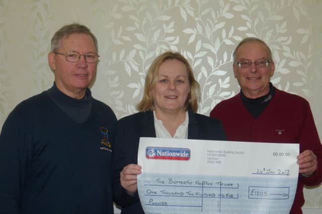 PIctured are Ray Smith with Linda Sanderson and Keith James.