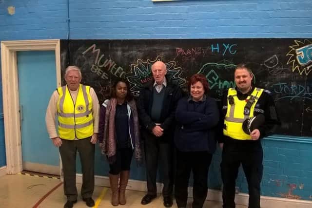 At the ready: Tony Clark (Lions), Cynthia Bobo (LCC), Malcolm Padley (Lions), Viv Cross (LCC) and PCSO Nigel Wass