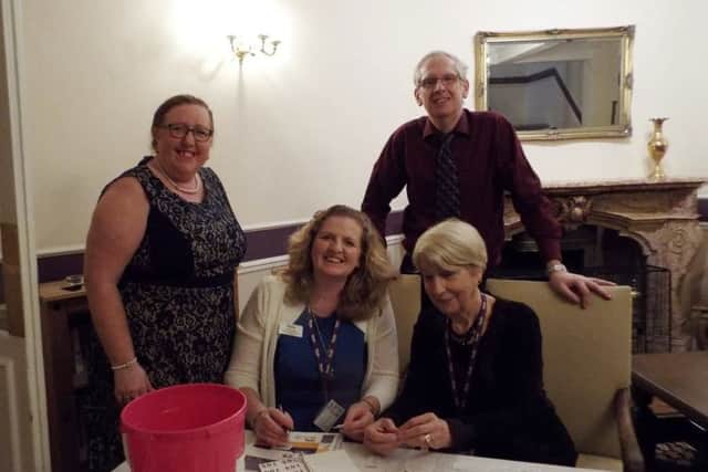 Barry and Pam, standing, at the charity evening.