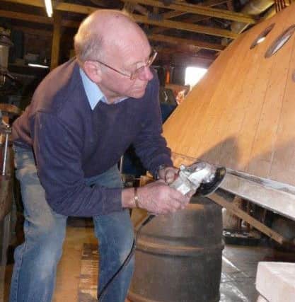 Terry Despicht working on the boat.