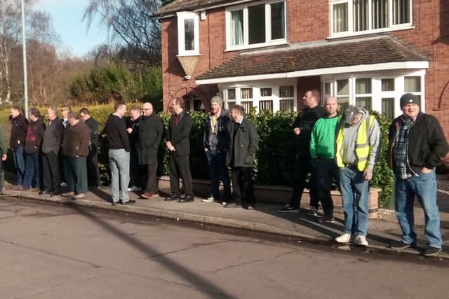 Pupils lined the path outside the crematorium and applauded in tribute as Derrick Sykes' hearse passed.