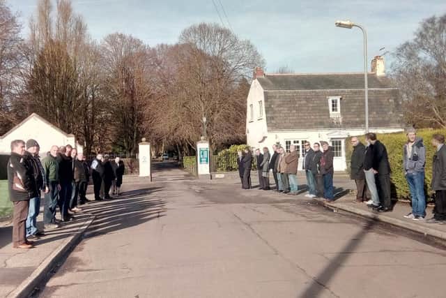 Pupils lined the path outside the crematorium and applauded in tribute as Derrick Sykes' hearse passed.