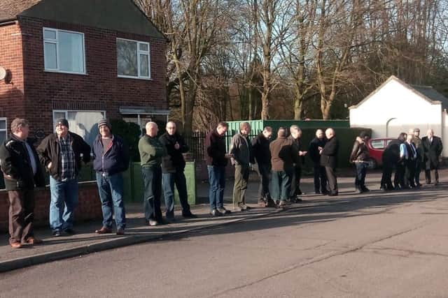 Pupils lined the path outside the crematorium and applauded in tribute as Derrick Sykes' hearse passed.
