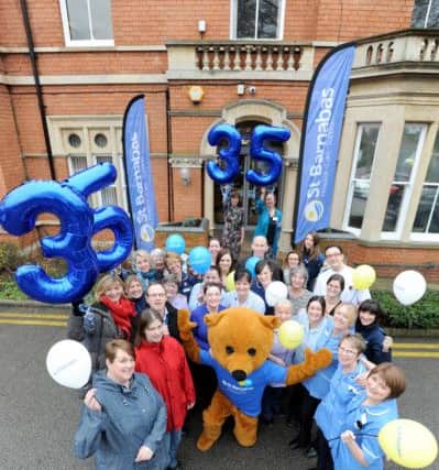 St Barnabas staff and volunteers are pictured outside the Nettleham Road Inpatient Unit in Lincoln
