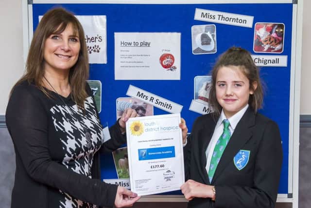 Teachers Pet competion winner Kitty Crossley,13, Year 8. She's pictured with Beverley Petchell, administrator for Louth and District Hospice Ltd.