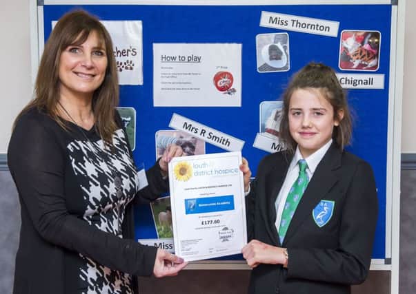 Teachers Pet competion winner Kitty Crossley,13, Year 8. She's pictured with Beverley Petchell, administrator for Louth and District Hospice Ltd.