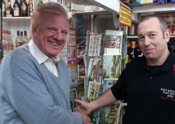 Sir Edward Leigh with Sub-Postmaster David Ward on his visit to East Barkwith Post Office last Friday EMN-170221-085451001