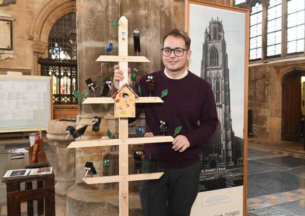 Say cheese...Head verger Adam Kelk pictured with the new addition to The Stump. EMN-170217-162850001