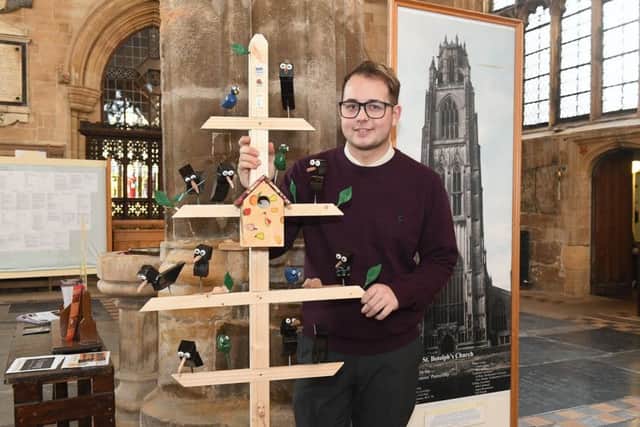 Say cheese...Head verger Adam Kelk pictured with the new addition to The Stump. EMN-170217-162850001