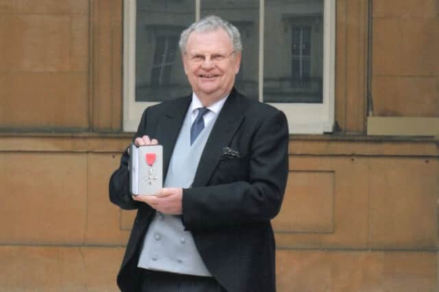 Dudley Byrant pictured with his MBE at Buckingham Palace. EMN-170221-112503001