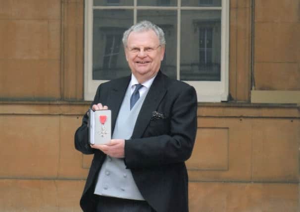 Dudley Byrant pictured with his MBE at Buckingham Palace. EMN-170221-112503001