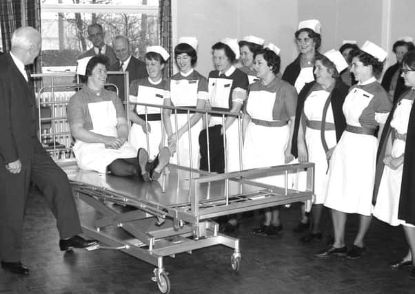 A demonstration of a height adjustable bed at Boston General Hospital in 1967. The bed had been made to a specification and design resulting from a study conducted by Kings Edward Fund for London in collaboration with the Arts Council.