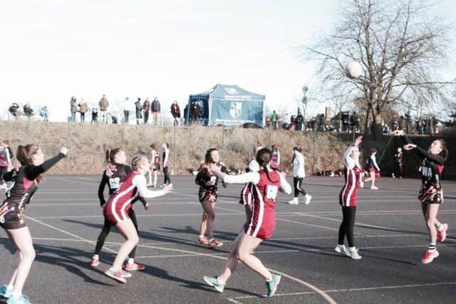 Carre's netballers (in black) in action during their victory over Ecclesbourne School EMN-170902-163650002